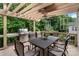 A covered deck with dining table and stainless steel grill is perfect for entertaining at 1929 Faison Ave, Fort Mill, SC 29708