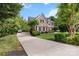 Charming brick house featuring a long driveway and lush landscaping at 1929 Faison Ave, Fort Mill, SC 29708