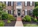 Inviting front entrance with a classic door, wreath, and manicured landscaping at 1929 Faison Ave, Fort Mill, SC 29708