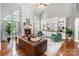 Vaulted living room with fireplace, custom built-ins, and arch-top windows at 1929 Faison Ave, Fort Mill, SC 29708