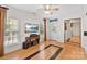 Living room featuring bamboo flooring, a mounted TV, and a window at 1929 Faison Ave, Fort Mill, SC 29708