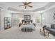 Expansive main bedroom with tray ceiling, sitting area, and dual windows at 1929 Faison Ave, Fort Mill, SC 29708
