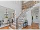 Elegant wooden staircase with iron balusters and natural light at 1929 Faison Ave, Fort Mill, SC 29708