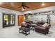 Finished basement area with a wood ceiling, armchairs and workout equipment at 1956 Forest Ridge Dr, Stanley, NC 28164