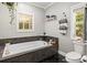 Bathroom with a soaking tub, granite countertop, and natural light at 1956 Forest Ridge Dr, Stanley, NC 28164