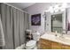 Updated bathroom features a vanity, toilet, and shower with tasteful accents at 1956 Forest Ridge Dr, Stanley, NC 28164