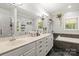 Bright bathroom features a luxurious tub, a spacious vanity, and decorative plants that add a touch of nature at 1956 Forest Ridge Dr, Stanley, NC 28164