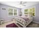 Cozy bedroom featuring carpeted floors, natural light and a ceiling fan at 1956 Forest Ridge Dr, Stanley, NC 28164