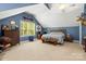 Spacious bedroom with carpeted floors, a ceiling fan and natural light at 1956 Forest Ridge Dr, Stanley, NC 28164