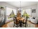 Inviting dining room featuring a wooden table, four chairs, chandelier, and bright natural light at 1956 Forest Ridge Dr, Stanley, NC 28164