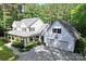 Spacious home featuring a covered front porch, two-car garage and lush landscaping at 1956 Forest Ridge Dr, Stanley, NC 28164