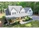 Charming two-story home with a large front porch and beautifully landscaped front yard and attached garage at 1956 Forest Ridge Dr, Stanley, NC 28164