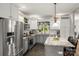 Modern kitchen with gray cabinets, stainless steel appliances, granite countertops, and center island at 1956 Forest Ridge Dr, Stanley, NC 28164