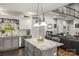 Well-appointed kitchen featuring an island with seating, stainless steel appliances, and open to the living room at 1956 Forest Ridge Dr, Stanley, NC 28164