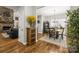 Elegant interior with hardwood floors connecting a living room with stone fireplace to a formal dining room at 1956 Forest Ridge Dr, Stanley, NC 28164