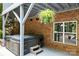 Back patio featuring a covered hot tub area, perfect for outdoor relaxation at 1956 Forest Ridge Dr, Stanley, NC 28164