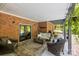 Relaxing outdoor patio featuring comfortable seating and a view of the backyard at 1956 Forest Ridge Dr, Stanley, NC 28164