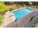 In-ground pool features a diving board, patio area, and lush landscaping at 1956 Forest Ridge Dr, Stanley, NC 28164