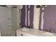 Updated bathroom with new white vanity, a double sink, and a tub with new shower at 2131 Barnett St, Lancaster, SC 29720