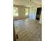 Spacious bedroom with new wood floors and two windows at 2131 Barnett St, Lancaster, SC 29720