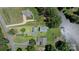 Aerial view of property, showcasing houses, lawns, and lake at 281 Emerald Shores Rd, Mount Gilead, NC 27306