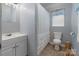 Bright bathroom with a vanity, toilet, and shower with curtain at 281 Emerald Shores Rd, Mount Gilead, NC 27306