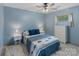 Serene bedroom featuring soft blue walls and a comfortable bed at 281 Emerald Shores Rd, Mount Gilead, NC 27306