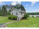 Charming home with a well-maintained lawn and beautiful lake views at 281 Emerald Shores Rd, Mount Gilead, NC 27306