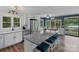 Beautiful kitchen with white cabinetry, stainless steel appliances, granite counters, and adjacent dining with lake views at 281 Emerald Shores Rd, Mount Gilead, NC 27306