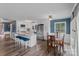 Bright kitchen featuring white cabinetry, stainless appliances, eat-in island, with an adjacent dining area at 281 Emerald Shores Rd, Mount Gilead, NC 27306