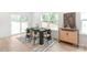 Elegant dining room with modern furniture, sleek wooden table, and bright windows that create a welcoming dining space at 2813 New Pineola Rd, Charlotte, NC 28208