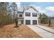 Charming two-story home featuring a white exterior, black accents, and a spacious driveway with a two-car garage at 2813 New Pineola Rd, Charlotte, NC 28208