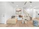 Stylish living room with a comfortable couch, modern decor, and a staircase, designed for a cozy and inviting atmosphere at 2813 New Pineola Rd, Charlotte, NC 28208