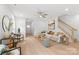 Airy living room showcasing stylish decor, natural light, and seamless flow to a staircase, perfect for modern living at 2813 New Pineola Rd, Charlotte, NC 28208
