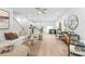 Open-concept living room with natural light, modern furnishings, and wood floors, creating a comfortable and inviting atmosphere at 2813 New Pineola Rd, Charlotte, NC 28208