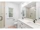 Modern bathroom with double vanity, sleek fixtures, and a glass-enclosed shower, exuding elegance at 2815 New Pineola Rd, Charlotte, NC 28208