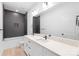 Modern bathroom featuring double sinks, sleek fixtures, and a tiled shower/tub combo at 2815 New Pineola Rd, Charlotte, NC 28208