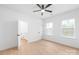 This bedroom has two windows and a view into the bathroom, with a ceiling fan adding comfort at 2815 New Pineola Rd, Charlotte, NC 28208