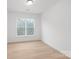 Cozy bedroom with neutral walls, a large window, and stylish flooring at 2815 New Pineola Rd, Charlotte, NC 28208