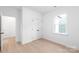 Bright bedroom with neutral walls, a large window, and stylish flooring at 2815 New Pineola Rd, Charlotte, NC 28208