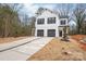 New construction featuring a two-story home with a two-car garage and a modern farmhouse design at 2815 New Pineola Rd, Charlotte, NC 28208