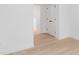 Bright hallway with wood floors and white trim at 2815 New Pineola Rd, Charlotte, NC 28208