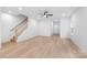 Spacious living room with hardwood floors, neutral paint, and a staircase leading to the second floor at 2815 New Pineola Rd, Charlotte, NC 28208