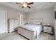 Comfortable bedroom features a tray ceiling, ceiling fan, and neutral decor at 3015 Great Falls Hwy, Chester, SC 29014