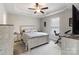 Cozy bedroom with tray ceiling, ceiling fan, and warm-toned carpet at 3015 Great Falls Hwy, Chester, SC 29014