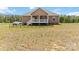 Exterior rear view of the home featuring a covered back porch at 3015 Great Falls Hwy, Chester, SC 29014