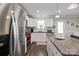 Bright kitchen with granite countertops, stainless steel appliances, and white cabinetry at 3015 Great Falls Hwy, Chester, SC 29014