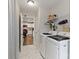 Laundry room with modern appliances, tiled floors and access to the kitchen at 3015 Great Falls Hwy, Chester, SC 29014