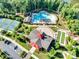 An aerial perspective of community amenities highlighting the pool, clubhouse, and tennis courts at 3103 Oliver Stanley Trl, Lancaster, SC 29720
