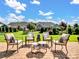 Beautifully landscaped backyard with a paver patio and comfortable seating, perfect for outdoor entertaining at 3103 Oliver Stanley Trl, Lancaster, SC 29720
